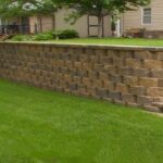 What challenges arise during retaining wall construction?