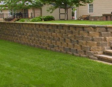 What challenges arise during retaining wall construction